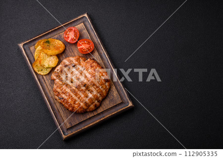 Delicious fresh grilled chicken fillet with spices and herbs 112905335