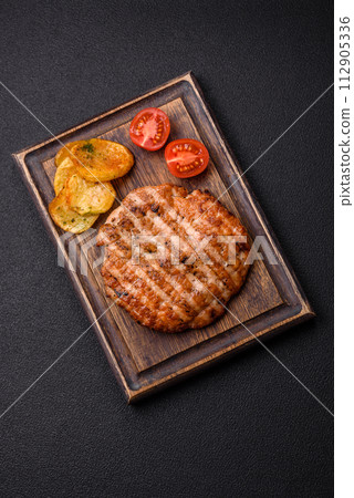 Delicious fresh grilled chicken fillet with spices and herbs 112905336