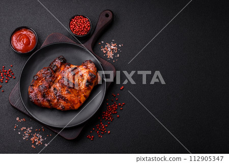 Fresh juicy delicious beef steak on a dark background 112905347