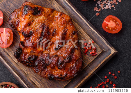 Fresh juicy delicious beef steak on a dark background 112905356
