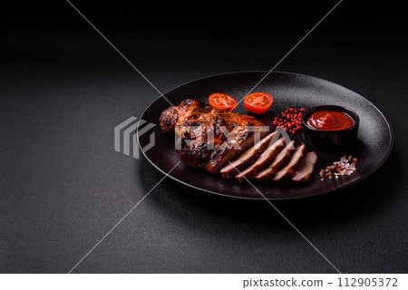 Fresh juicy delicious beef steak on a dark background 112905372