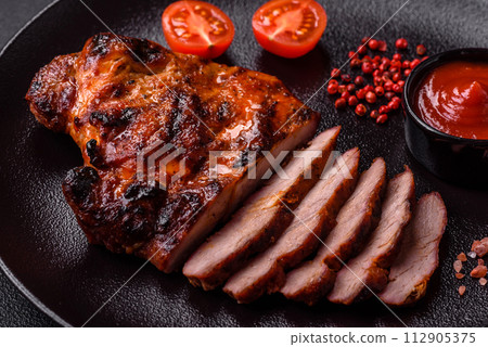 Fresh juicy delicious beef steak on a dark background 112905375