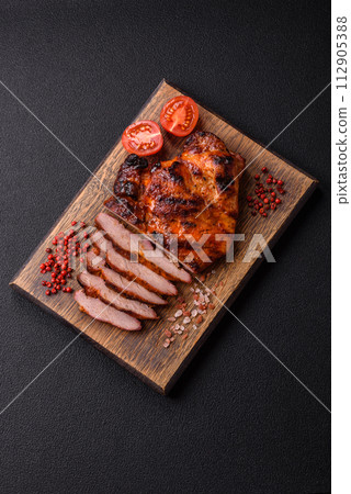 Fresh juicy delicious beef steak on a dark background 112905388