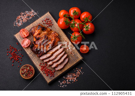 Fresh juicy delicious beef steak on a dark background Fresh juicy delicious beef steak on a dark background 112905431
