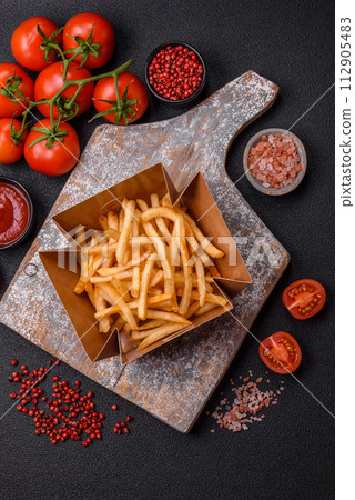 Delicious crispy golden fries with salt and spices Delicious crispy golden fries with salt and spices 112905483