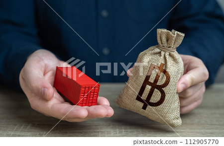 Ship container and thai baht money bag. Distribution logistics worldwide. Transportation and freight of goods and cargo through ports or overland routes. Trade and delivery. 112905770