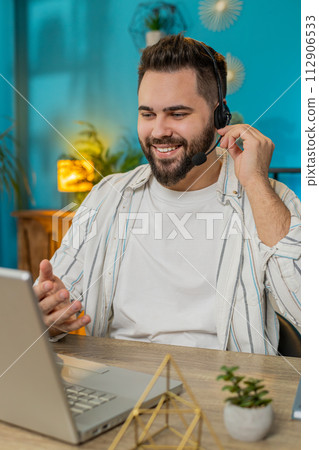 Business man wearing headset, freelance worker, call center or support service operator helpline 112906533