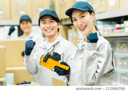 Young staff doing light work in the backyard 112906768