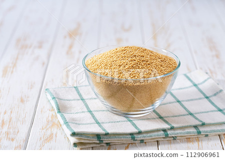 organic amaranth in a glass plate on a white wooden table. organic amaranth in a glass plate on a white wooden table. 112906961