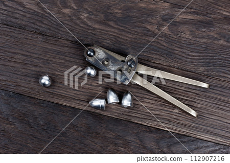 Antique old west bullet mold with bullets for revolver. 112907216