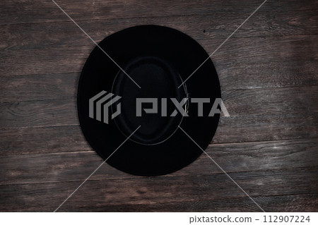 Old west hat on table. Top view. 112907224