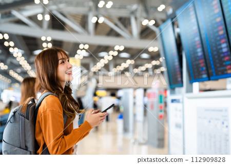 Young asian woman in international airport 112909828