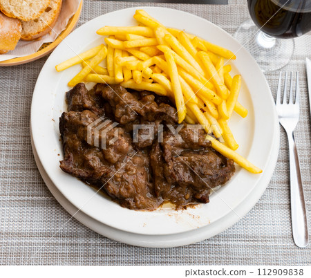 Traditional dish of French cuisine is Beef bourguignon Traditional dish of French cuisine is Beef bourguignon 112909838