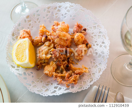 Chipirones, battered fried baby squid 112910439