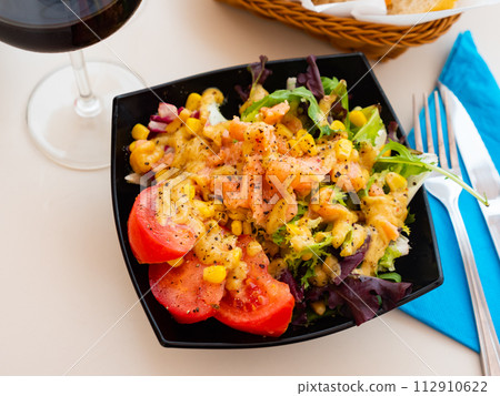 Salad with smoked salmon, tomato, corn, greens Salad with smoked salmon, tomato, corn, greens 112910622