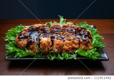 One plate of pork cutlet with sauce One plate of pork cutlet with sauce 112911482