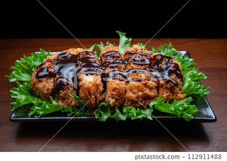 One plate of pork cutlet with sauce One plate of pork cutlet with sauce 112911488