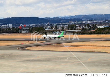 Airplane seen from Sendai International Airport observation deck 112911541