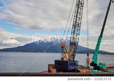 Snow-covered Sakurajima and development construction scenery 112913172