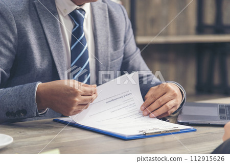 Close up manager businessman hands sign contract working meeting. Asian business man using pen signing on new contract to starting projects in conference room.  Business agreement concepts. 112915626