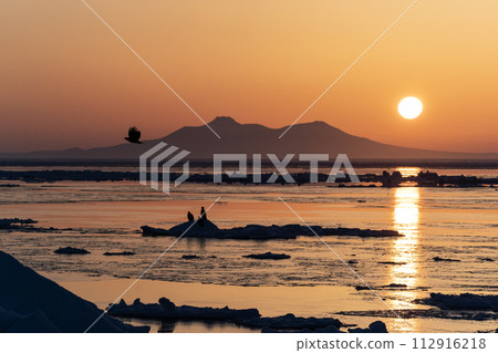 Sunrise and drift ice from Kunashir Island Sunrise and drift ice from Kunashir Island 112916218