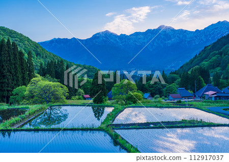 (Nagano Prefecture) Rice terraces and remaining snow in the Northern Alps of Hakuba Village and Aoni Village 112917037