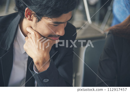 Asian Man thinking wear eyeglasses using laptop at home office. Desperate man stress headache depressed from startup small business at home office. Failure businesman working holding smart tablet 112917457