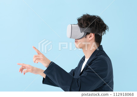 Man using VR goggles 112918068