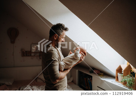 Father holding his newborn baby. Unconditional paternal love, Father's Day concept. Father holding his newborn baby. Unconditional paternal love, Father's Day concept. 112919406