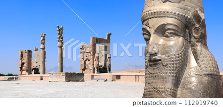 Horizontal banner with Gate of All Nations (Xerxes Gate) and face of assyrian protective deity lamassu - human-headed winged bull, Persepolis, Iran Horizontal banner with Gate of All Nations (Xerxes Gate) and face of assyrian protective deity lamassu - human-headed winged bull, Persepolis, Iran 112919740