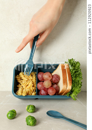 Yellow lunch box with food on a white background Yellow lunch box with food on a white background 112920923