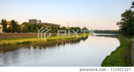 cityscape with river uzh. embankment of the downtown with drama theater on the other shore in the distance 112921327