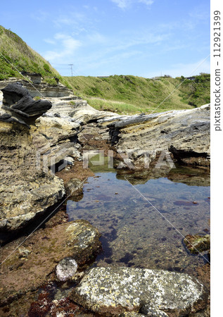 Rocky shore Seaside environment with tide Rocky shore Seaside environment with tide 112921399