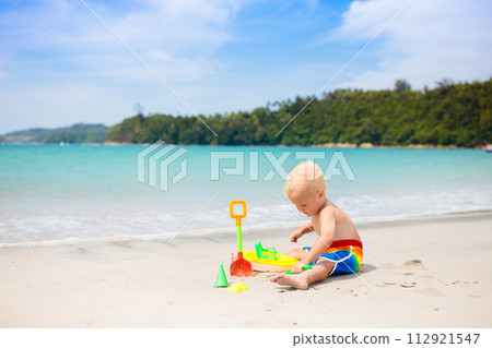 Kids playing on beach. Children play at sea. 112921547