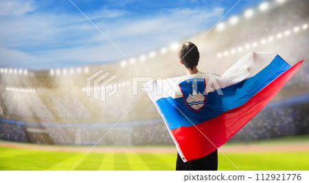 Slovenia football team supporter on stadium. Slovenia football team supporter on stadium. 112921776