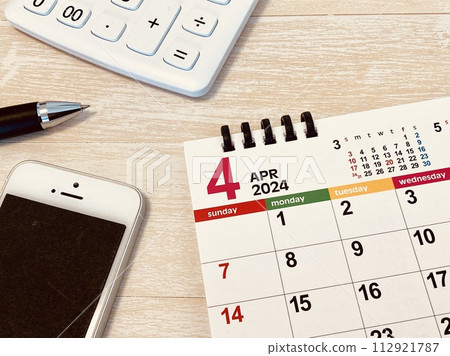 April calendar (on desk/business) 112921787