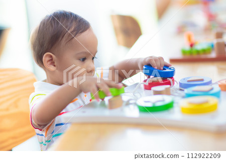 Cute baby boy in kindergarten or daycare. Cute baby boy in kindergarten or daycare. 112922209
