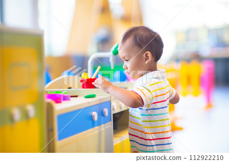 Cute baby boy in kindergarten or daycare. Cute baby boy in kindergarten or daycare. 112922210