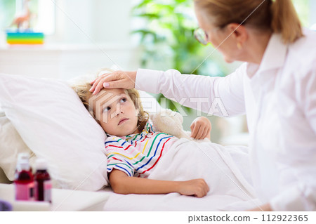 Sick little boy with asthma medicine. Ill child. Sick little boy with asthma medicine. Ill child. 112922365