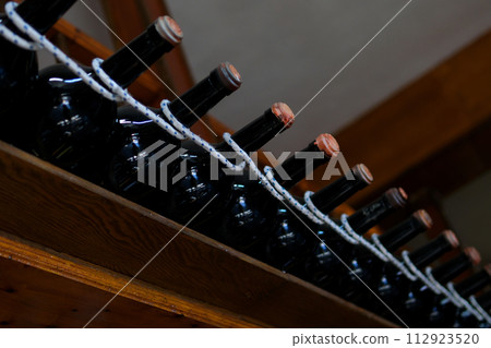 Beautiful serving of alcoholic drinks Winery Cognac wine in a wooden barrel 112923520