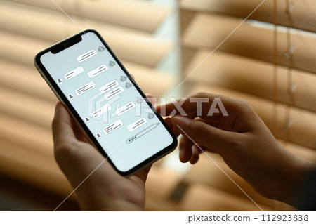 Close up shot of woman using AI Chat bot in mobile application to get support Close up shot of woman using AI Chat bot in mobile application to get support 112923838