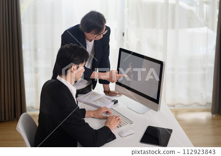 Professional businessman discussing project developing financial research at office 112923843