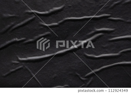 black crumpled and creased plastic poster texture background 112924349