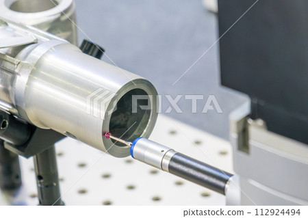 The multi axis CMM machine measuring the aluminum automotive parts. The multi axis CMM machine measuring the aluminum automotive parts. 112924494