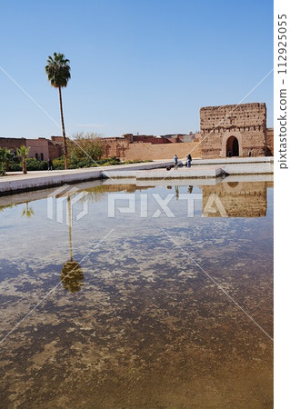 Western pavilion of El Badi palace reflected in water in Marrakech city in Morocco - vertical Western pavilion of El Badi palace reflected in water in Marrakech city in Morocco - vertical 112925055