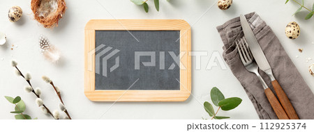 table setting with chalkboard, vintage cutlery, easter eggs and spring branches table setting with chalkboard, vintage cutlery, easter eggs and spring branches 112925374