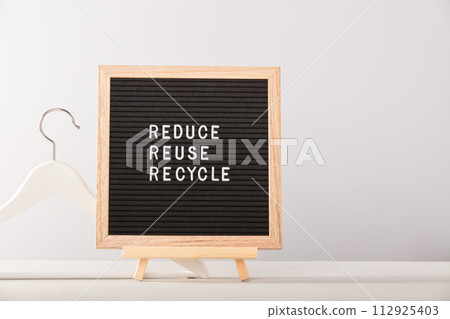 letter board with motivational quote and wood hanger 112925403