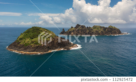 Tropical island and blue sea. Dos Hermanos Island. Santa Ana, Cagayan. Philippines. 112925472