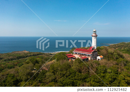 Beautiful lighthouse on the cape Bojeador view from above. Ilocos Norte, Philippines. Beautiful lighthouse on the cape Bojeador view from above. Ilocos Norte, Philippines. 112925482