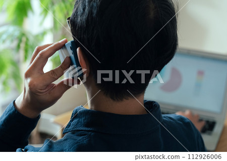 A man calling on a smartphone A man calling on a smartphone 112926006
